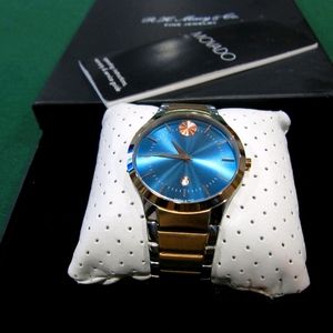 Movado Two Tone Bezel Watch
Yellow/ White gold